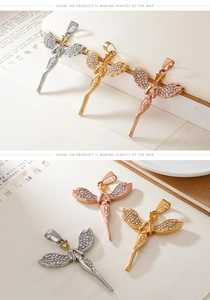 Detailed view of angel wing pendants with cubic zirconia and engraved Angel text