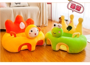 Detail view of plush infant support seats in orange crown and green frog designs