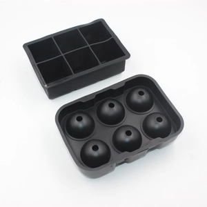 Detailed view of black silicone 6-cavity square and spherical ice cube tray molds
