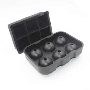 Detail of a black silicone spherical ice mold with 6 holes shown in two separate parts