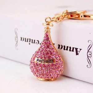 Pink rhinestone perfume bottle keychain with rose gold plating and parfum engraving