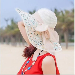 Women's foldable wide brim straw sun hat with colorful woven edge and large bow