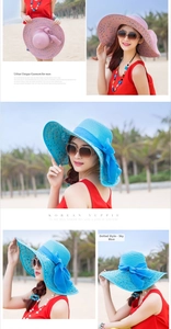 Details von rosa und hellblauen Strohhüten mit Schleife und Punkten am Sandstrand