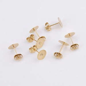 Flat round gold-plated stainless steel stud earrings base with butterfly backings on white