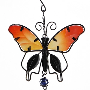 Detailed view of orange gradient glass butterfly wings with blue glass bead pendant