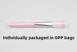 Detail showing a pink gradient makeup brush individually packed in a clear OPP bag