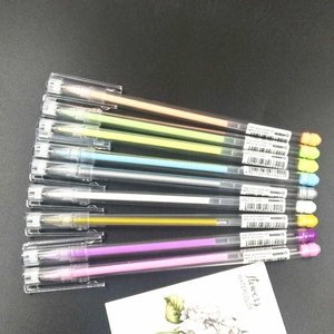 Detail of 9-color high gloss pastel gel pens with transparent barrels on dark background