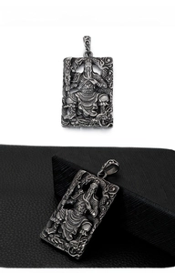 Detailed macro view of retro Guan Gong warrior pendant with dragon relief patterns
