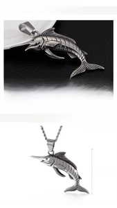Macro shot of punk swordfish pendant in stainless steel with twisted chain details