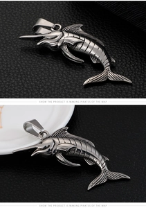 Detailed close-up of retro silver stainless steel swordfish pendant with fish scale texture