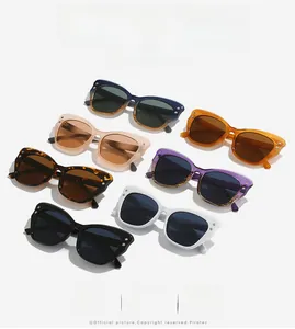 Detailed grid of fashion cat-eye sunglasses in seven colors with sleek metal rivets