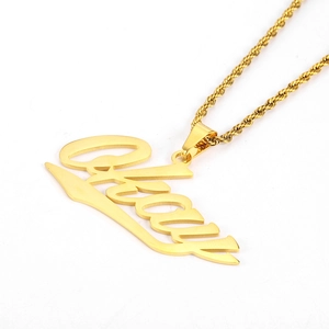 Detailed close-up of golden Baby letter pendant on a twisted rope chain necklace