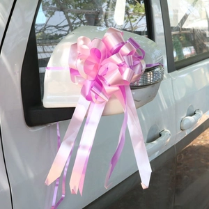 Pink purple decorative ribbon bow tied on car side mirror for wedding gift wrapping