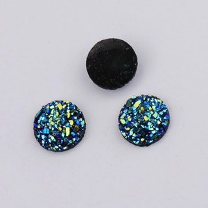 Detail of 10mm round resin druzy charms with teal iridescent glitter and black flat back