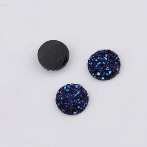 Macro shot of 10mm blue-purple druzy resin cabochons showing textured front and flat back