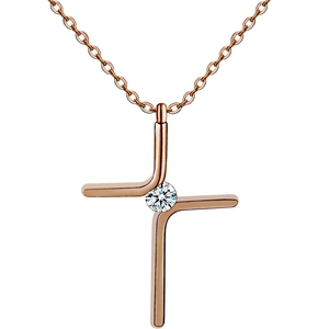 Detail of rose gold cross pendant with a brilliant round-cut white gemstone center