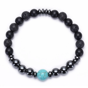 Detailed macro view of lava stone and tiger eye beads in a black matte beaded bracelet