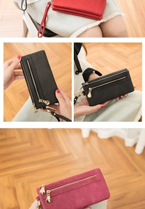 Detail view of retro long PU leather wallet with wristlet strap and zipper closure