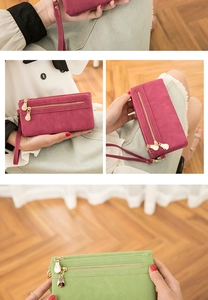 Detail of vintage long faux suede wallet with gold double zippers and wristlet strap