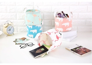 Detailed close-up of a high-quality cotton canvas storage basket with a flamingos print