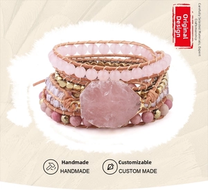 Macro shot of handmade multilayer pink quartz bracelet with irregular raw gemstone detail