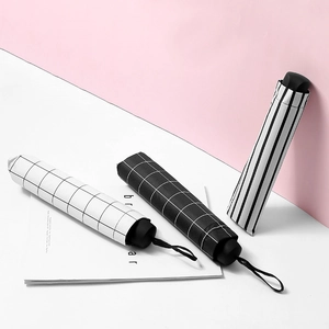 Minimalist striped folding sun umbrella with UV protection in three classic patterns