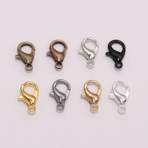 Macro view showing eight different metallic color lobster clasps for DIY jewelry making