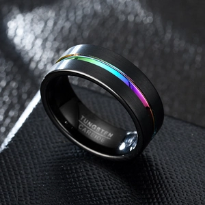 8mm black brushed tungsten carbide ring with rainbow inlay for men on leather surface