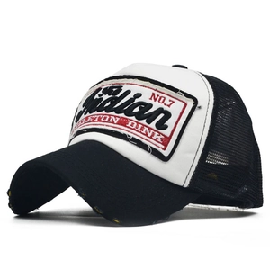 Detailed view of vintage mesh trucker hat with Indian No.7 embroidery and distressed brim