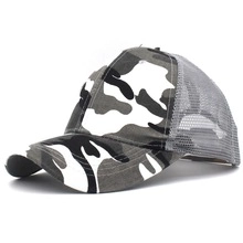 Detail view of the breathable gray mesh and camouflage pattern on this sun visor cap