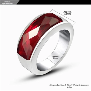 Detailed view showing a 7.8mm wide silver steel ring with a large red faceted gemstone