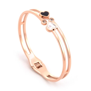 Rose gold stainless steel bangle with black and white heart charms and crystals