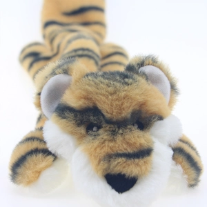 Detail of tiger-shaped squeaky plush dog toy with yellow and black stripes