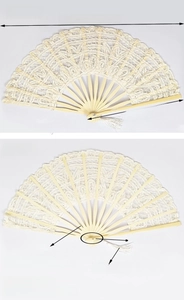 Detail of vintage cream lace folding fan with natural bamboo ribs and white silk tassel