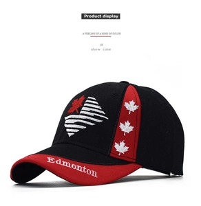 Detail of Edmonton embroidery and maple leaf design on a black cotton baseball cap