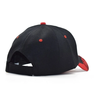 Detail of baseball cap with red eyelets and adjustable velcro strap closure