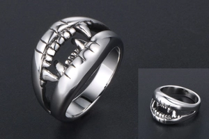 Detailed view of polished stainless steel ring featuring unique crocodile tooth design