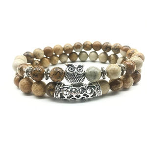 Detail view of double-layer owl bracelet set with picture jasper stone beads