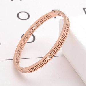 Rose gold stainless steel bangle featuring a hollow Greek meander pattern for women
