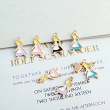Macro shot of colorful enamel alloy charms for DIY jewelry making on white paper
