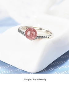 Detail of S925 silver ring featuring pink strawberry crystal and white zircon accents