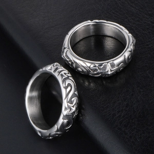 Vintage silver pentagram star rings for couples with intricate metal engravings on black leather