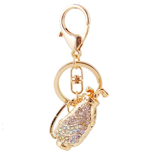 Golden golf bag keychain with sparkling rhinestones on a clean white background