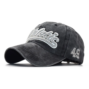 Detail of vintage washed dark gray baseball cap with 3D Athletic letter embroidery
