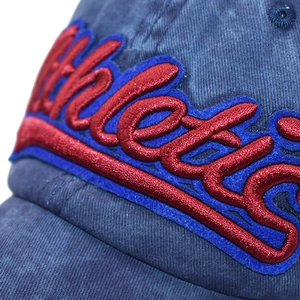 Close-up of navy cotton baseball cap with red and blue 3D Athletic patch embroidery