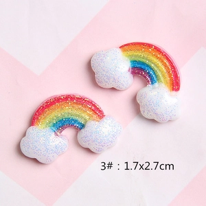 Detailed view of glitter resin rainbow cloud charms for DIY hair clips and shoes, 1.7x2.7cm
