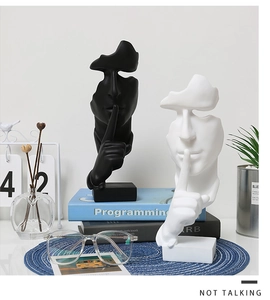 Artistic resin sculptures in black and white with a silent gesture on a square base