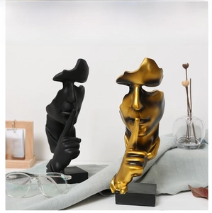 Artistic resin Silence is Gold sculpture set in matte black and vintage gold finishes