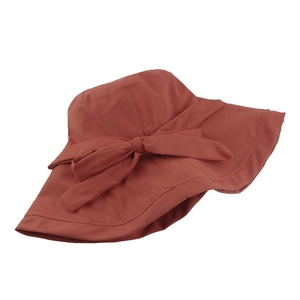 Foldable wide brim sun hat for women with bow tie detail in brick red color