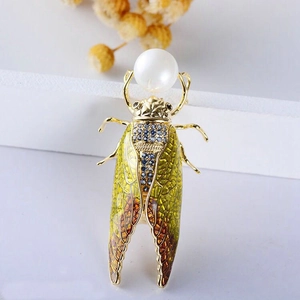 Exquisite golden cicada brooch with colorful enamel wings and large white imitation pearl